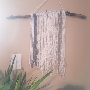 Shag wall hanging on branch